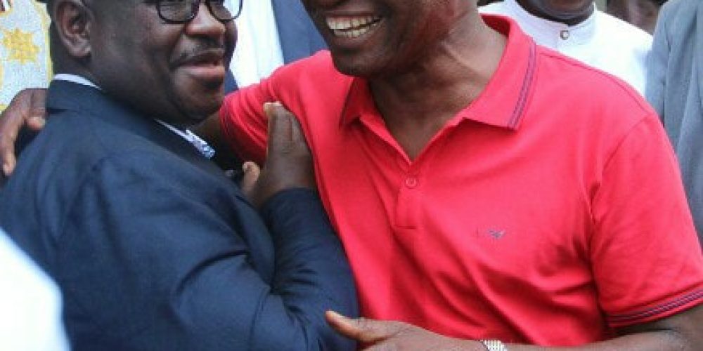 President Bio and Dr. Samura Kamara in warm hug